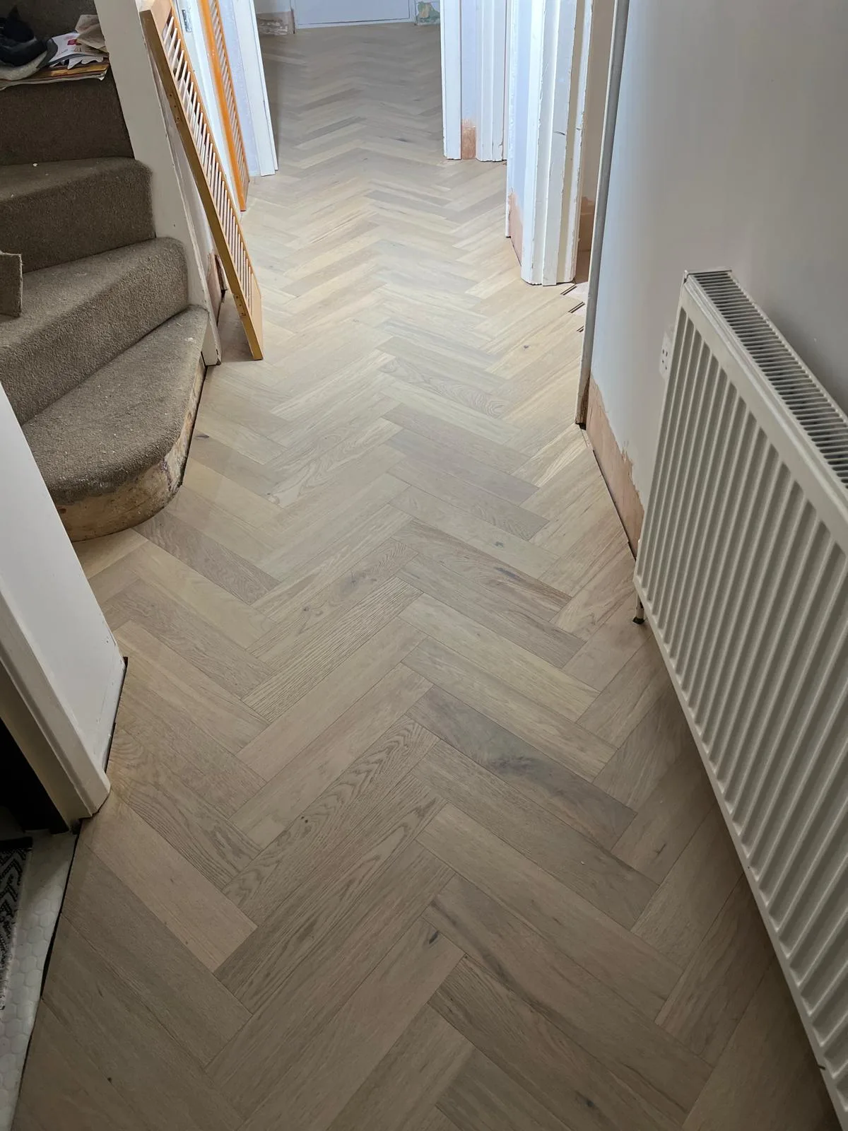 Finished herringbone wood flooring installation by NB Flooring LTD