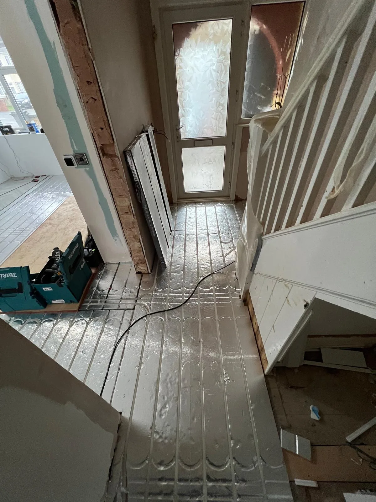 Underfloor heating installation before flooring is fitted